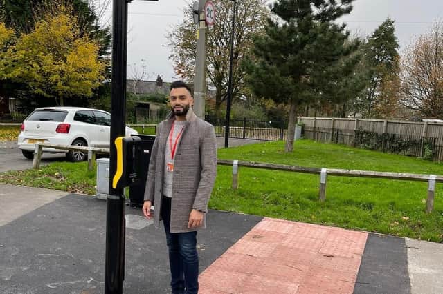 Cllr Samir Khan at the new pedestrian lights on Pilling Lane