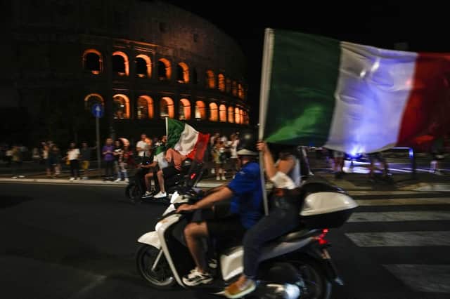 Italy fans celebrate reaching the final of Euro 2020, in which they beat England on penalties. (Credit: AP Photo/Alessandra Tarantino)