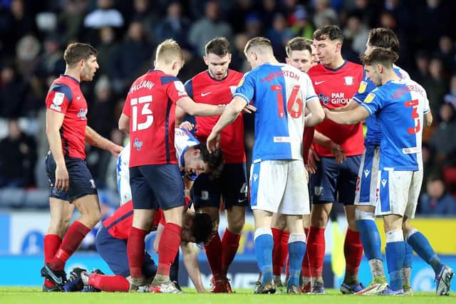Preston North End and Blackburn Rovers players come together during the derby at Ewood Park
