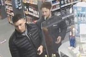 Do you recognise these men? Police want to speak to them after a man was robbed of his Peugeot 108 car in Sudellside Street, Darwen (Credit: Lancashire Police)