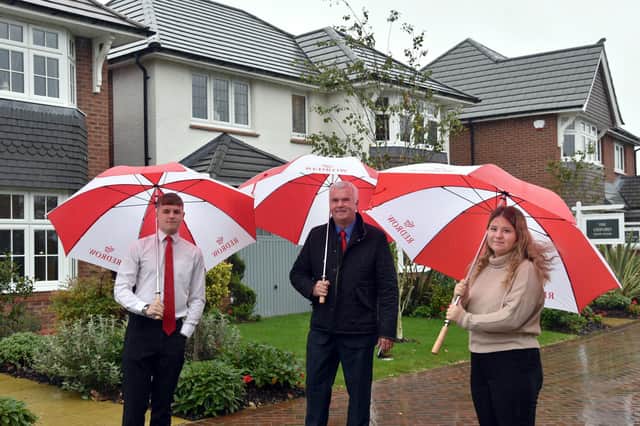 Redrow apprentices Jack Davies and Lucy Parkinson with Redrow Lancashire’s Construction Director Keith Collard.