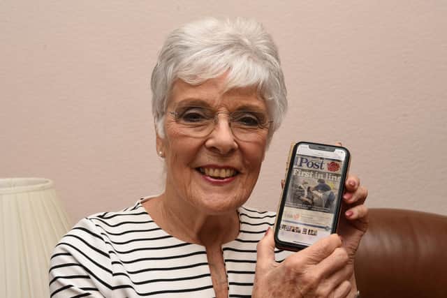 Doreen McKeown says vaccines make life "near as normal as it can be", as she poses with her Lancashire Post front page from December 2020 marking the moment she became the first person in the county to receive the Covid jab (image: Neil Cross)