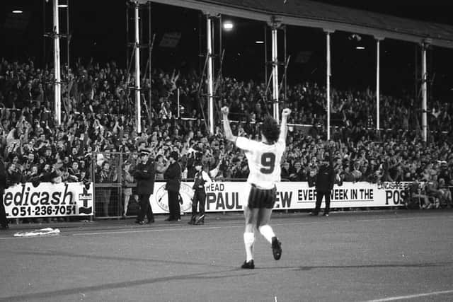 PNE striker John Thomas celebrates in front of the West Stand paddock after scoring against Chorley