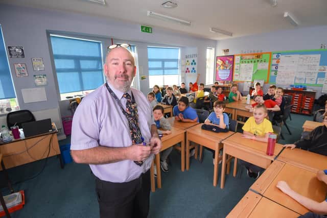 Graeme Dow, headteacher at Anchorsholme Primary Academy steps in to teach a class as there is no supply staff available