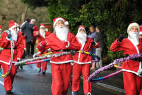Santas hula hoop their way round the Galloways Santa Dash in 2019. After a virtual dash last year, the event returns to Penwortham at the weekend