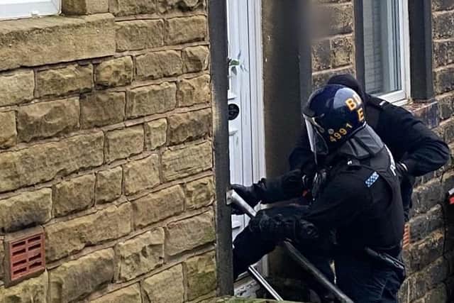 Suspected crack cocaine, cannabis, machetes and £7,000 in cash were seized by police following multiple raids in East Lancashire (Credit: Lancashire Police)
