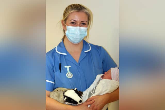 Baby Phoebe Hope Bennet, one of Burnley's first 'digital' babies with midwife Laura Archer.