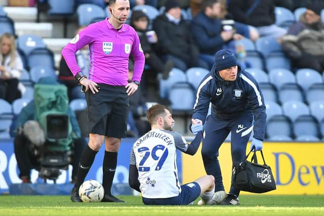 Tom Barkhuizen, pictured with physio Matt Jackson, suffered an injury against Fulham after a bad tackle