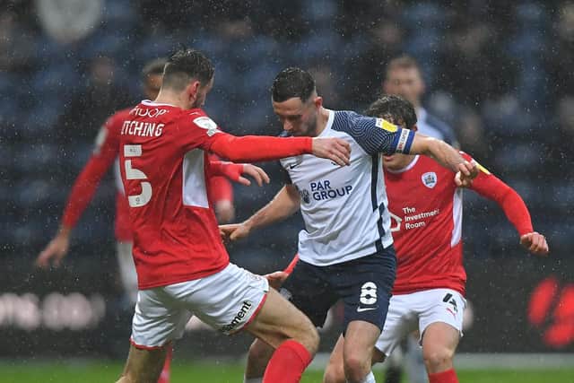 PNE skipper Alan Browne competes for the ball against Barnsley at Deepdale