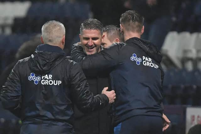 Manager Ryan Lowe is congratulated on his first win in charge
