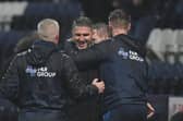 Manager Ryan Lowe is congratulated on his first win in charge