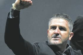 Preston North End manager Ryan Lowe salutes the home supporters