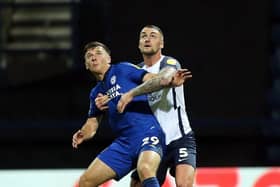Preston North End defender Patrick Bauer competes with Cardiff City's Mark Harris at Deepdale in November