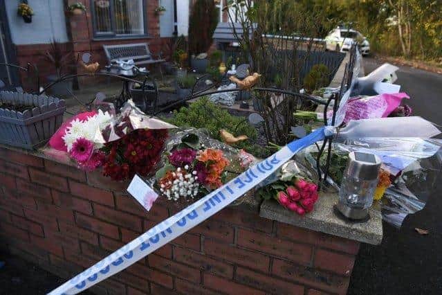 Tributes left at the scene of the double murder in Cann Bridge Street, Higher Walton on November 20, 2021