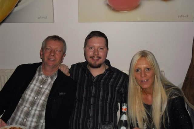 Lee Tipping (centre), with his parents Tricia Livesey and Anthony Tipping