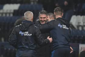 Ryan Lowe celebrates Preston North End's victory over Barnsley with Mike Marsh and Paul Gallagher