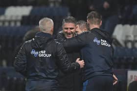 Ryan Lowe celebrates Preston North End's victory over Barnsley with Mike Marsh and Paul Gallagher