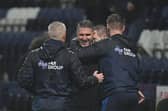 Ryan Lowe celebrates Preston North End's victory over Barnsley with Mike Marsh and Paul Gallagher