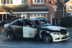 Maggie Booth and her husband were driving along Leyland Lane on Saturday (December 18) when a dog walker gestured at them in a panic, signalling for them to pull over. Unknown to them, their Mercedes was on fire. Moments later, after scrambling out of the car, the car burst into flames. Pic: Steven Smith