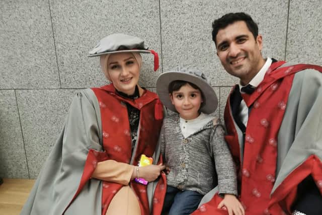 Dr Joud Sabouni (left) and Dr Murhaf Jalab (right) with their son Majed at their UCLan graduation ceremony