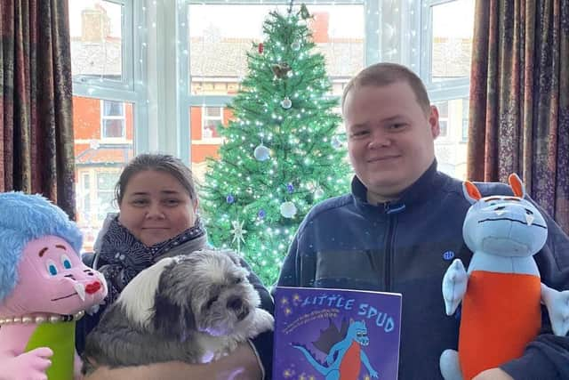 Author Marie Stell, Winston the Shih Tzu, and Christopher with the Little Spud the dragon book and characters made by Janet Earl