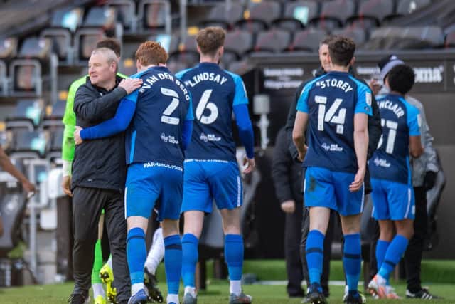 Frankie McAvoy congratulates the PNE players after their 1-0 win over Swansea City at the Liberty Stadium in April