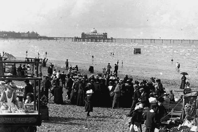 Morecambe sands with the West End Pier in the background in 1900. Local traders make the most of the crowds of visitors enjoying some of the town's growing attractions