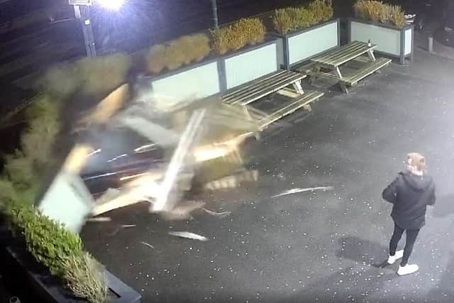 Pub goers were nearly run over when the driver of a stolen car ploughed into a beer garden in Skelmersdale on Monday (December 27)