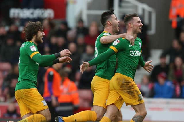 Alan Browne celebrates with Andrew Hughes and Ben Pearson after giving PNE the lead against Stoke