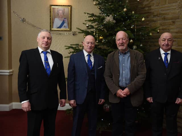 Ian Simm, Peter Allen and Malcolm Schofield of Chorley and Leyland Free Masons presenting a cheque to Ken Phillips of Chorley Help the Homeless.