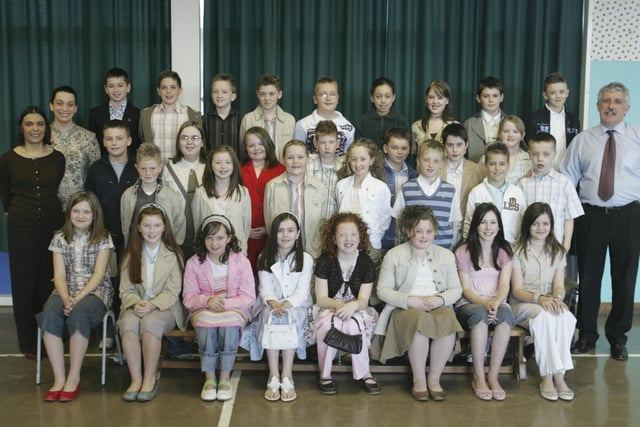 Pupils from Greenhaw Primary School, who were confirmed in St. Brigid's church, Carnhill, by Most Rev. Dr. Francis Lagan, Auxiliary Bishop of Derry. Included are Mrs. Vindi Torney, principal, Ms. Lisa McGrath, classroom assistant, and Mr. Robert McLaughlin, class teacher. (0404C31)