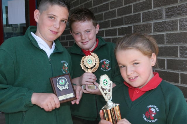 Greenhaw Primary School pupils who collected awards at the school's annual prize-giving.  From  left, Cain Breslin, Most Improved Footballer, David Harris, Male Penalty Kick cup and Emma McGlinchey, Female Penalty Kick cup.  (2806T03).