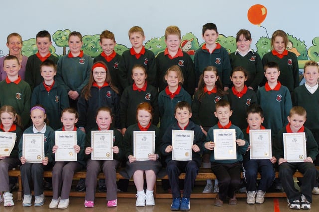 P5 pupils from Greenhaw Primary School receive certificates for completing a paired reading programme. (0505PG13)
