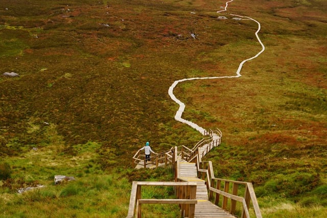 Known as the stairway to heaven, the Cuilcagh Boardwalk is a scenic walk in Fermanagh that offers spectacular views and is known for its famous wooden steps.