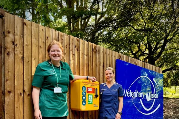 Pictured beside a defibrillator that has been installed at Bamber Bridge, from left of the box: Kate Sands, lead vet and clinical opthalmologist and Louise Redmond, lead veterinary nurse