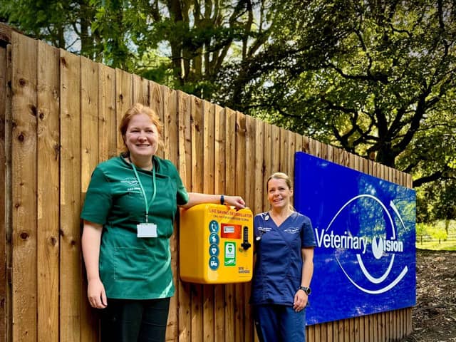 Pictured beside a defibrillator that has been installed at Bamber Bridge, from left of the box: Kate Sands, lead vet and clinical opthalmologist and Louise Redmond, lead veterinary nurse