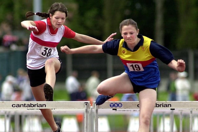 Lancashire County Schools Athletics Tournament at Stanley Park sports centre. Winner No 19 Hannah Sawer, 15, from Lancaster, and Chantelle Stirzaker, 15, from Wyre Athletic Club competing in the 80 metre hurdles