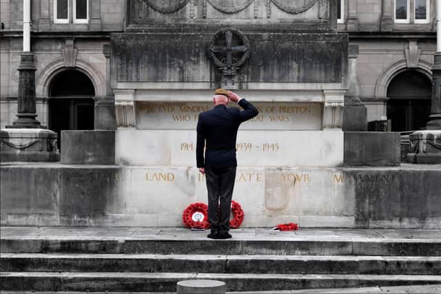 Former Scots Guards Warrant Officer Mark Jackson lays a wreath on behalf of the Central Lancashire Armed Forces Veterans Association.