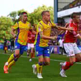 Morecambe midfielder JJ McKiernan was forced off in the first half at Harrogate Town Picture: Jack Taylor