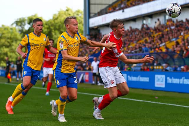 Morecambe midfielder JJ McKiernan was forced off in the first half at Harrogate Town Picture: Jack Taylor