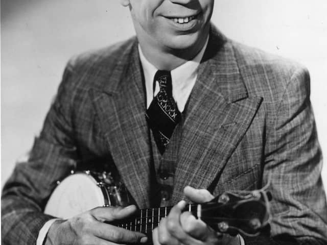circa 1945:  Comic entertainer George Formby (1904 - 1961) playing a banjolele.  (Photo by Hulton Archive/Getty Images)