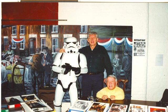 Green Cross Code man David Prowse who was Darth Vader in the Star Wars Trilogy is pictured with Kenny Baker, who played the robot R2D2 in the films and a Storm Trooper at Botany Bay, Chorley in November 1999