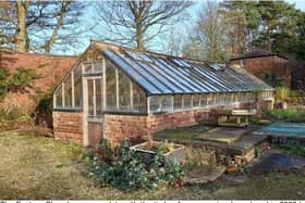 This is how the glasshouse looked in 2008 before its timber frame became too unsafe.