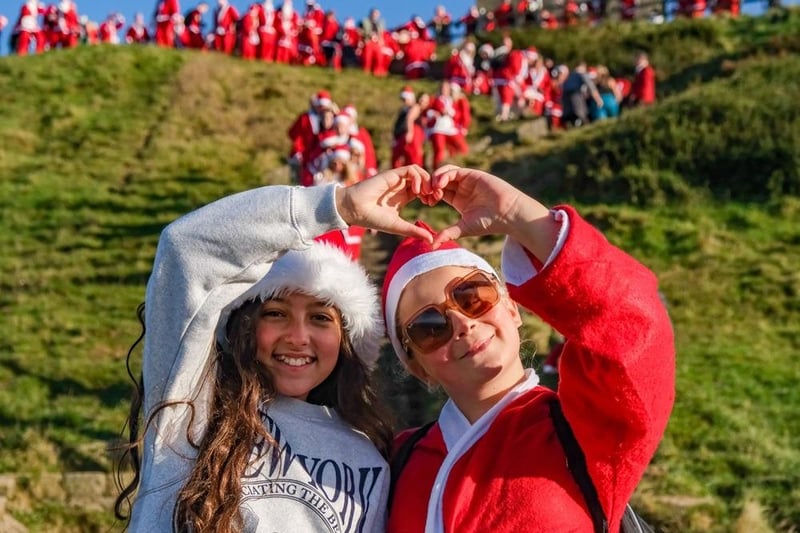 Doing it for Derian House - Santas pose beside Rivington Pike