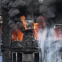 Smoke billows from a fire that has engulfed the 24-storey Grenfell Tower in west London in 2017.
