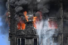 Smoke billows from a fire that has engulfed the 24-storey Grenfell Tower in west London in 2017.