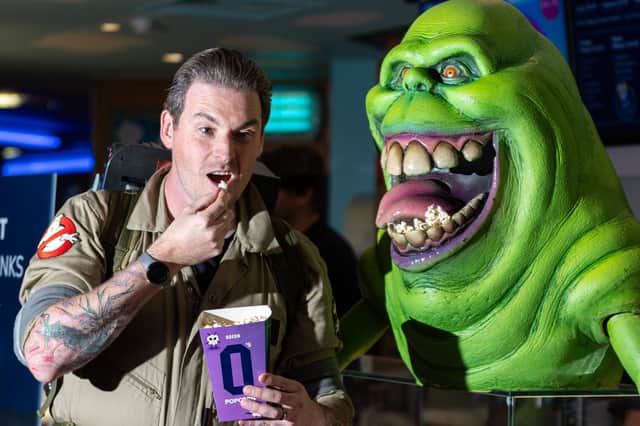 Mike Bell of the Preston City Ghostbusters with Slimer surprised film goers with a surprise visit to Oden Cinema in Preston. Photo: Kelvin Lister-Stuttard