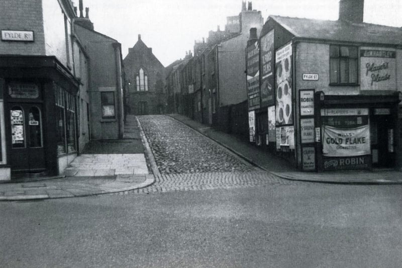 This view of Mill Hill, Preston, at the junction of Mill Hill and Fylde Road, dates from 1950. Mill Hill took its name from the long demolished Friargate Windmill which was built on the high ground at the top of the hill. 