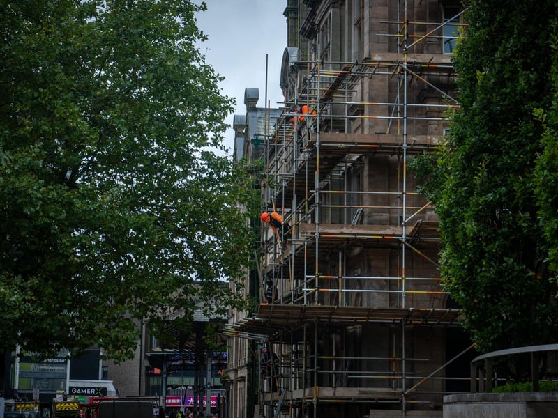 Workmen erecting scaffolding on the former Post Office building in Preston City Centre