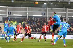 PNE's Will Keane sends a header wide of the target (photo: Shaun Brooks/CameraSport)